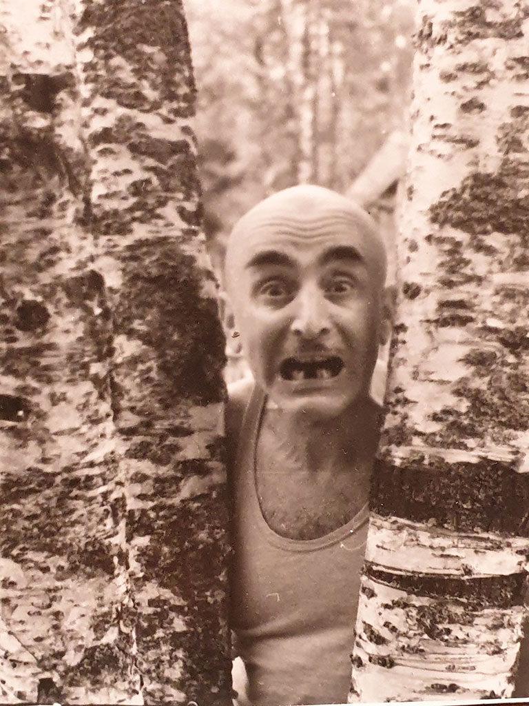 “Candidate of Mathematical Sciences, Associate Professor of the Mining Institute Verzhbinsky M. L.”, a comic photograph of Mikhail Verzhbinsky between two birches with blackened teeth, 1960